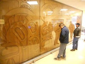 Students from Freda Diesing School stand in front of a large plaque at the Prince Rupert Hospital. The plaque was designed by Freda Diesing and carved by Josiah Tait.